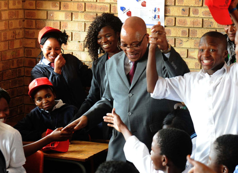 President Jacob Zuma and Kagiso Hlagala during a walkabout in ISHP Mobiles; Health Screening and Health Education Observation at Chipa Tabane Secondary  School in Refilwe, Cullinan. Source: GCIS