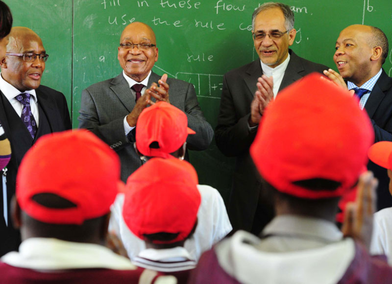 Minister of Health Dr Aaron Motsoaledi; President Jacob Zuma; Deputy Minister of Basic Education Enver Surty and Tshwane Municipality Executive Mayor Kgosientso Ramakgopa during a walkabout in ISHP Mobiles; Health Screening and Health Education Observation at Chokoe Primary School in Refilwe, Cullinan. Source: GCIS