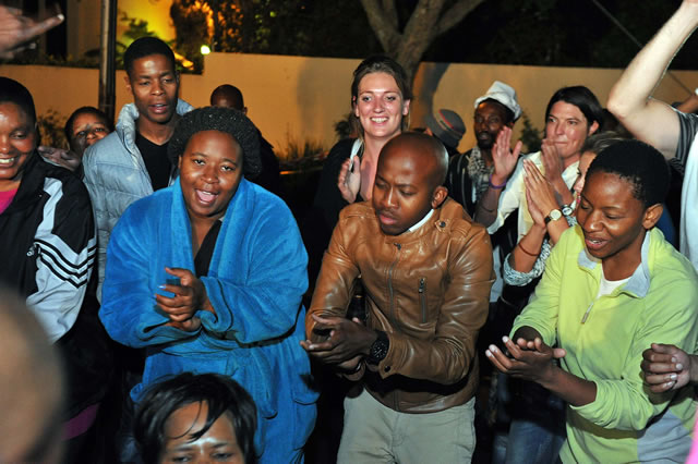 Mourners holding a night vigil in song and dance outside the late former President Nelson Mandela's Home in Houghton. Source: GCIS