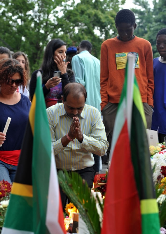 Mourners pay their last respects to Madiba outside his Houghton home. Source: GCIS