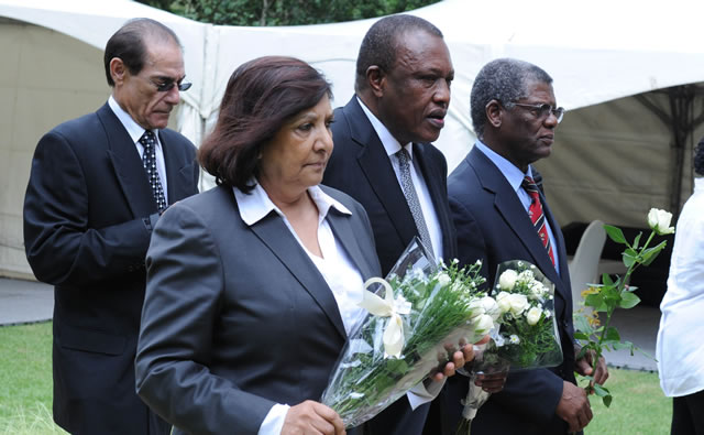 Orlando Pirates chairman Ivan Khoza and Thandile Babalwa Sunduza laying flowers outside Nelson Mandela's house in Houghton. Source: GCIS