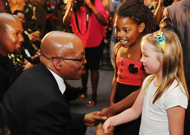 President Zuma interacts with children at Bryanston Methodist Church at a prayer service for Madiba. Source: GCIS