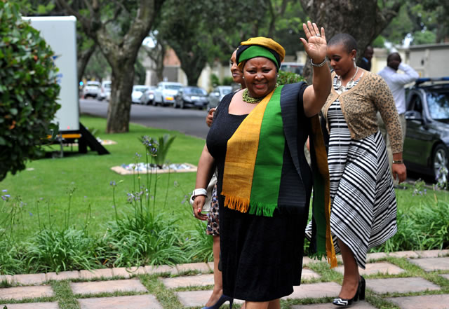 Defence Minister Nosiviwe Mapisa Nqakula waving to the crowd outside the Mandela household in Houghton. Source: GCIS