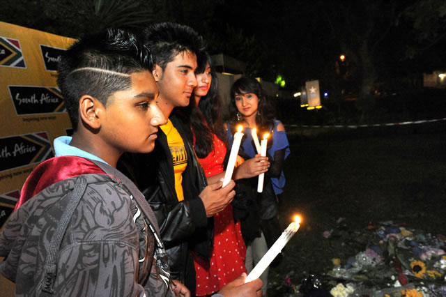 South Africans gather to light candles outside Madiba’s home in Houghton Johannesburg. Source: GCIS