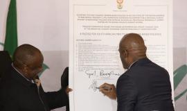 Northern Cape Premier Zamani Saul and President Ramaphosa sign the pledge to end GBV.