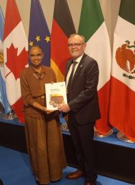 Minister George with his Brazilian counterpart, Marina Silva, handing over the G20 presidency baton.