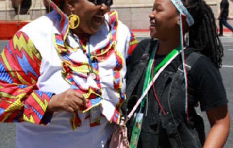 Water and Sanitation Minister Pemmy Majodina and SONA 2025 imbongi, Inako Mateza, outside the Cape Town City Hall.